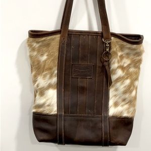 Canoe leather and cowhide shoulder bag.